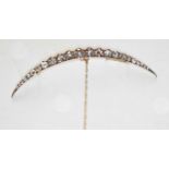 A FINE 19TH CENTURY DIAMOND CRESCENT BROOCH, set with twenty three round, old,