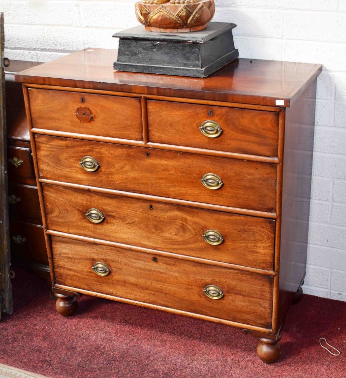 A VICTORIAN MAHOGANY CHEST, with three long and two short drawers, raised on bulbous legs, 42.