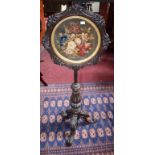 A VICTORIAN WALNUT POLE SCREEN, with wool tapestry panel depicting flowers,