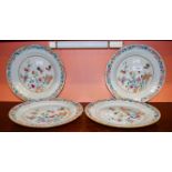 A SET OF FOUR LATE 18TH CENTURY CHINESE FAMILLE ROSE PLATES each centred with a hen and cockerel by