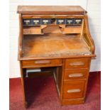 AN OAK ROLL TOP SINGLE PEDESTAL DESK,