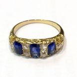 A GOOD SAPPHIRE AND DIAMOND RING, set with three rectangular sapphires and four small diamonds,