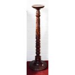 A PAIR OF MAHOGANY JARDINIERE STANDS OR TORCHERES, with spiral reeded and turned stem, 44.