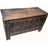 AN 18TH CENTURY OAK COFFER CHEST, the rectangular plank top, opening to reveal a vacant interior,