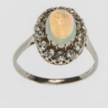 AN OPAL AND DIAMOND CLUSTER RING, set on a platinum band,