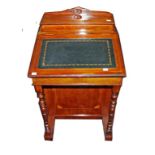 AN EDWARDIAN INLAID DAVENPORT, with slope top, on pedestal base with four drawers, 21" (54cm)w.