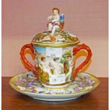 A 19TH CENTURY NAPLES RELIEF MOULDED PORCELAIN CHOCOLATE CUP COVER AND STAND,