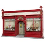 A VERY UNUSUAL PINE MODEL OF AN OLD IRISH PUB FRONT, with two windows, flanking a double door,