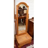 A PAIR OF MODERN PITCH PINE ARCHED TOP CHEVAL DRESSING MIRRORS,