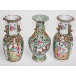 A PAIR OF CHINESE FAMILLE ROSE VASES, each with two temple lion handles,