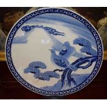 A LARGE JAPANESE BLUE AND WHITE SAUCER DISH, decorated with birds,