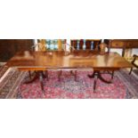 A FINE REGENCY STYLE MAHOGANY DINING TABLE, with three spare leaves,
