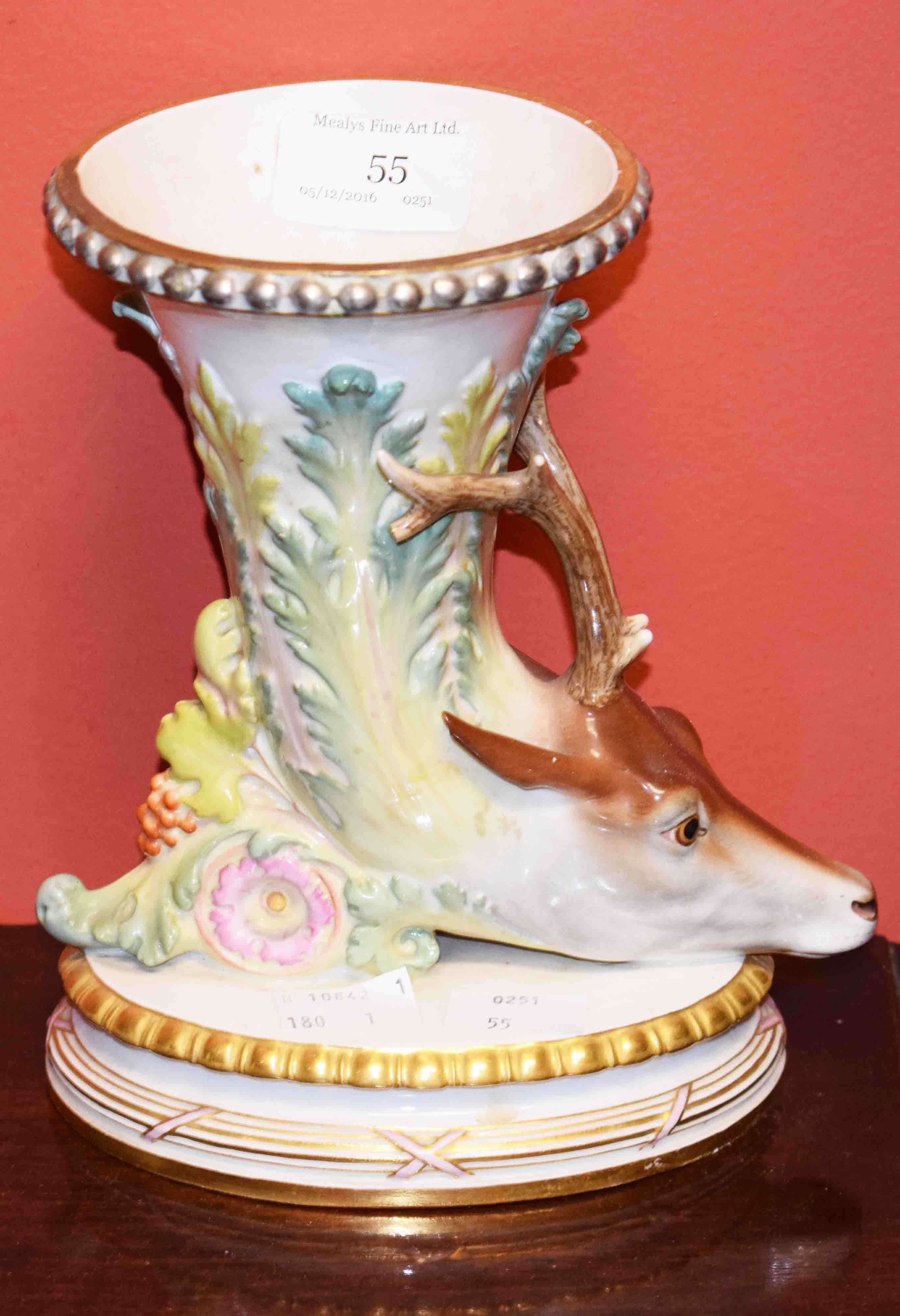 A LARGE 19TH CENTURY MEISSEN CORNUCOPIA VASE, with stag head terminal on an oval base, 7.5” (19cm).