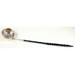 A SILVER PUNCH LADLE, THE BOWL INSET WITH A SPANISH GOLD HALF ESCUDO 1754, TWISTED BALEEN HANDLE