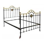 A VICTORIAN BRASS AND IRON BED
