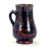 A 16TH CENTURY NORTHERN EUROPEAN LEAD GLAZED EARTHENWARE JUG OF BALUSTER SHAPE, 21CM H