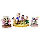 A GERMAN PORCELAIN GROUP OF FOUR CHILD MUSICIANS ON OVAL BASE, 17CM H, A SITZENDORF FLORAL ENCRUSTED