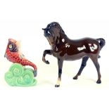 A BESWICK EARTHENWARE HORSE AND A DOLPHIN VASE