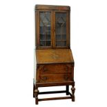 AN OAK BUREAU BOOKCASE, CIRCA 1910