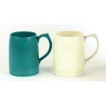 TWO WEDGWOOD EARTHENWARE MUGS DESIGNED BY KEITH MURRAY, ONE GREEN GLAZED, THE OTHER OF QUEEN'S WARE,