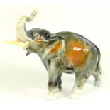 A ROYAL DUX PORCELAIN MODEL OF AN ELEPHANT