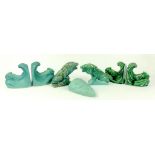 TWO PAIRS OF LOVATT'S GREEN GLAZED FISH BOOKENDS, ONE MATT, A PAIR OF SIMILAR MODELS OF LIONS BY THE