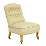 A VICTORIAN GILTWOOD NURSING CHAIR WITH BUTTONNED BACK, ON CASTORS