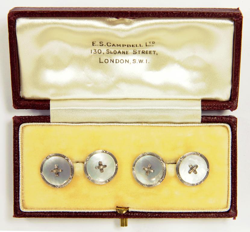 A PAIR OF 9CT WHITE GOLD AND MOTHER OF PEARL CUFFLINKS, EACH WITH A CENTRAL STITCH, BIRMINGHAM 1961,