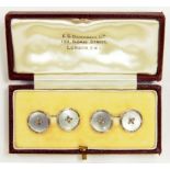 A PAIR OF 9CT WHITE GOLD AND MOTHER OF PEARL CUFFLINKS, EACH WITH A CENTRAL STITCH, BIRMINGHAM 1961,