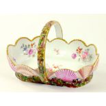 A SPODE BONE CHINA SCALLOP SHELL BORDERED BASKET DECORATED IN BRIGHT ENAMELS AND PAINTED TO THE