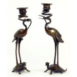 A PAIR OF JAPANESE BRONZE CANDLESTICKS IN THE FORM OF A STORK ON A  TURTLE, 28CM H, MEIJI PERIOD