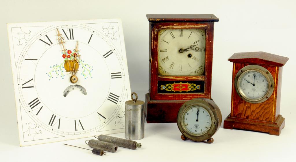 VINTAGE MOTORING.  TWO 1930'S SMITH'S DASHBOARD CAR CLOCKS IN ASSOCIATED OAK CASES, LARGEST 20CM