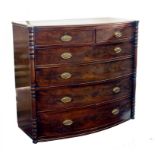 A VICTORIAN MAHOGANY BOW FRONTED CHEST OF DRAWERS WITH OUTSET RING TURNED PILASTERS, 120CM W