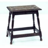 A VICTORIAN CARVED AND DARK STAINED OAK JOINT STOOL, 52CM W