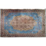 A BLUE/CHOCOLATE BROWN PERSIAN STYLE RUG