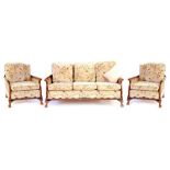 A 1930'S WALNUT AND CANED THREE PIECE BERGERE SUITE