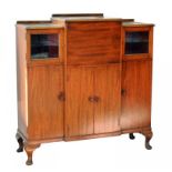 A MAHOGANY BREAKFRONT COCKTAIL CABINET, 111CM W