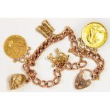 A GOLD CHARM BRACELET, THE CHARMS INCLUDING A HALF SOVEREIGN 1899 AND USA TWO AND A HALF DOLLARS