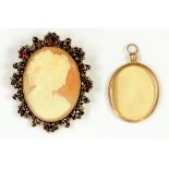 A CAMEO BROOCH WITH GARNET SURROUND AND A GOLD PHOTO LOCKET