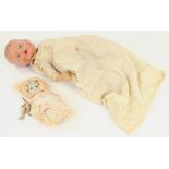 A COMPOSITION BABY DOLL, 16CM H, CIRCA 1930 AND A BISQUE MINIATURE CHILD CHARACTER DOLL, EARLY