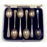 A SET OF SIX GEORGE V SILVER GOLFING COFFEE SPOONS, SHEFFIELD 1933, CASED 2OZS 10DWTS