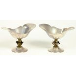 A PAIR OF ELIZABETH II SILVER BON BON DISHES, THE BOAT SHAPED BOWL SET ON A CAST ROSE AND DOMED