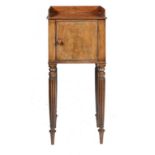 A GEORGE IV MAHOGANY POT CUPBOARD IN THE MANNER OF GILLOWS, C1825 on reeded tapering turned legs,