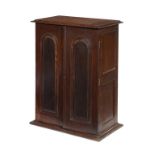 A VICTORIAN MAHOGANY CUPBOARD, POSSIBLY FROM A SHIP'S CABIN the pair of raised and fielded arched