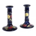 A PAIR OF MOORCROFT WISTERIA CANDLESTICKS, C1920-25 16cm h, impressed mark, painted initials ++