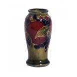 A MOORCROFT MINIATURE POMEGRANATE VASE, C1915-25 6cm h, impressed mark, green painted initials ++