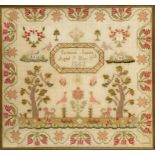 A VICTORIAN COARSE LINEN SAMPLER WORKED BY SUSANNA JONES, DATED 1843 in coloured wool with oak