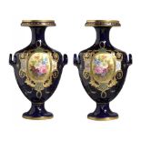 A PAIR OF TURN TWO HANDLED COBALT GROUND VASES, EARLY 20TH C in the form of a Hydria and in the