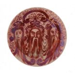 AN ENGLISH PORCELAIN EXPERIMENTAL RUBY LUSTRE PLATE, DATED APRIL 1911 pained with the heads of three