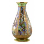 A WEDGWOOD FAIRYLAND LUSTRE VASE DESIGNED BY DAISY MAKEIG JONES, C1920 in the Pillar pattern, 30cm